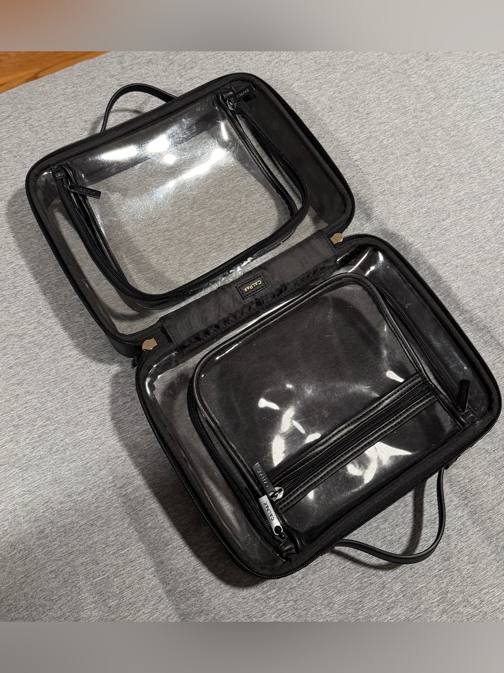 Calpak clear cosmetics/toiletry case